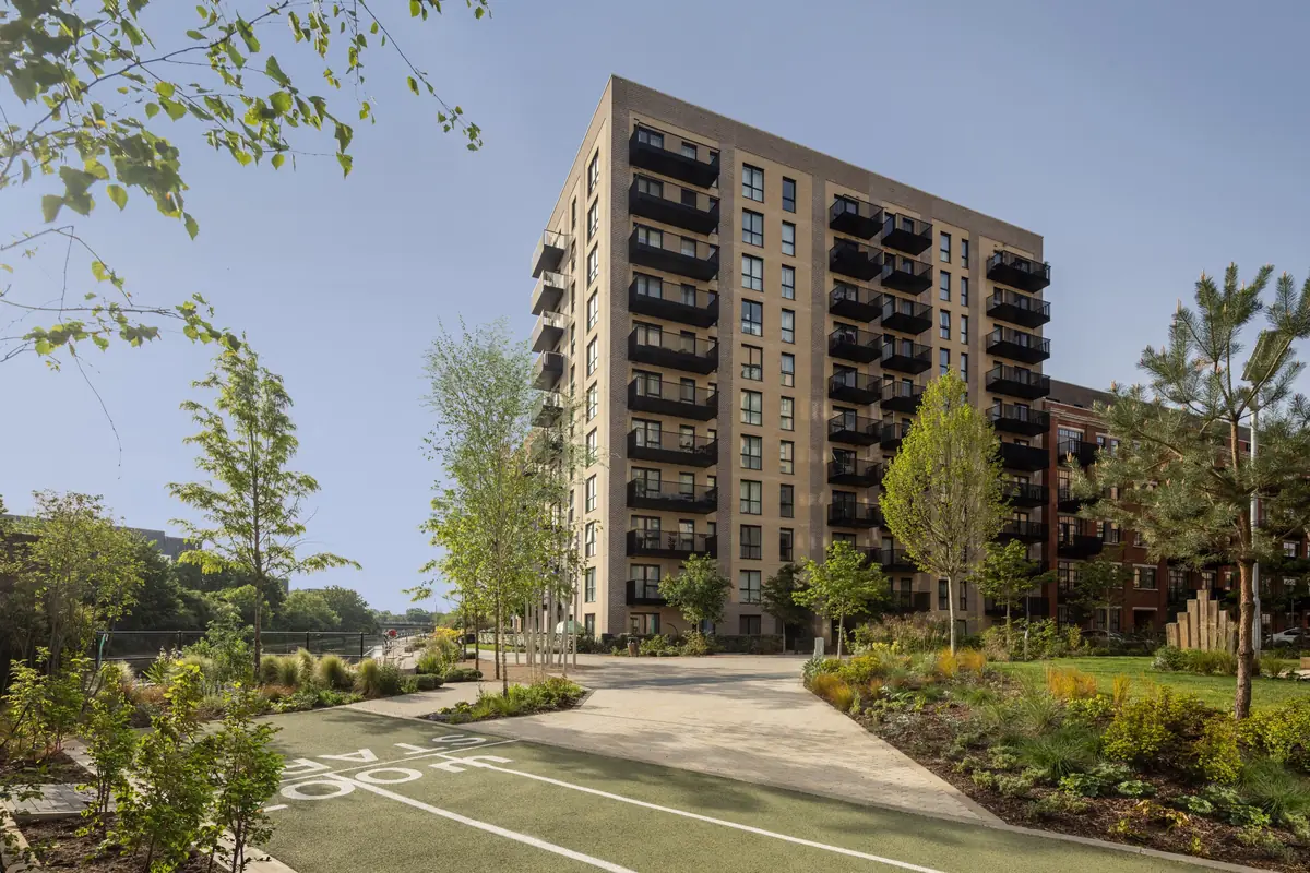 Hayes Village apartment building beside landscaped paths