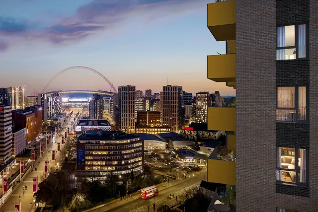 Computer-generated evening view towards Wembley Stadium from the development